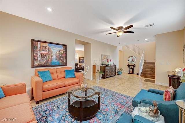 living room with light tile patterned floors and ceiling fan