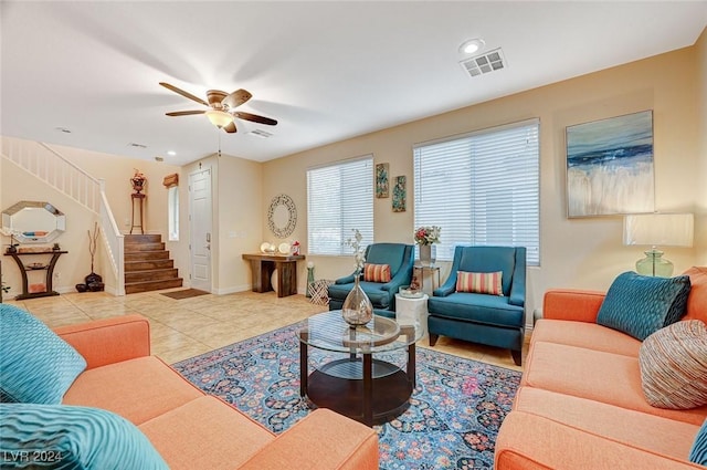 tiled living room featuring ceiling fan