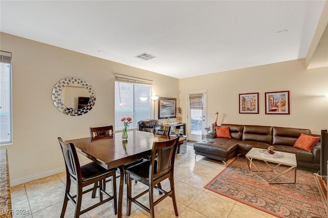 dining area with light tile patterned floors