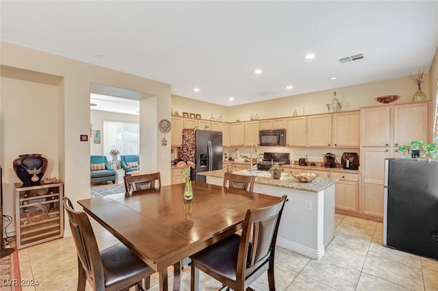 tiled dining area with beverage cooler