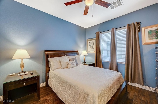 bedroom featuring ceiling fan and dark hardwood / wood-style flooring