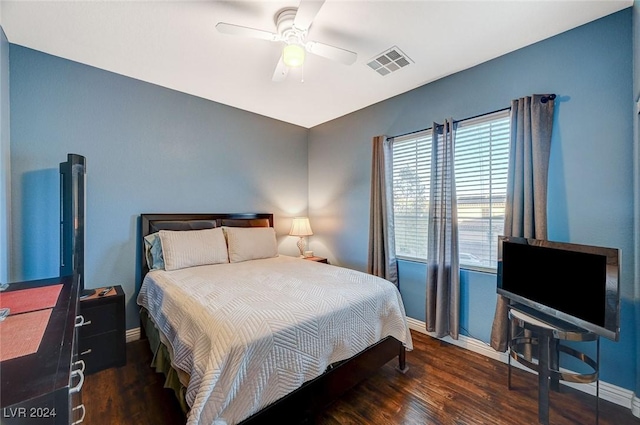 bedroom featuring ceiling fan and dark wood-type flooring