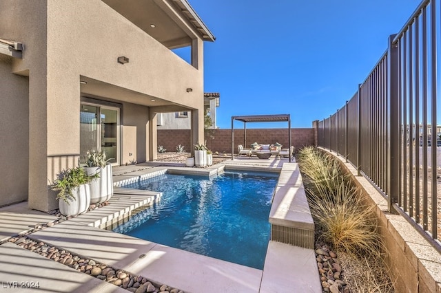 view of swimming pool featuring a patio and an outdoor hangout area