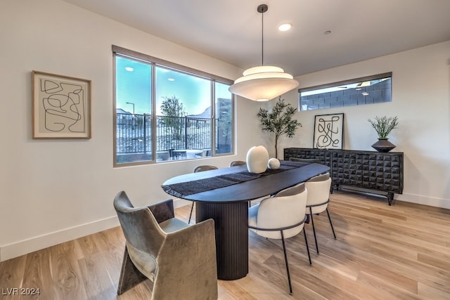 dining space with light hardwood / wood-style floors