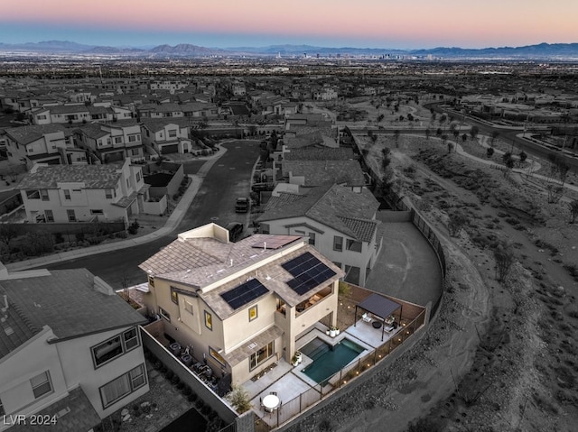 aerial view at dusk with a mountain view