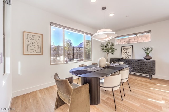 dining area featuring light wood-type flooring