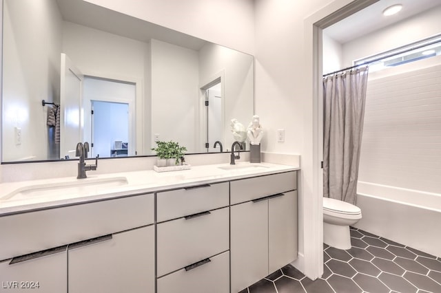 full bathroom featuring tile patterned floors, vanity, toilet, and shower / tub combo with curtain