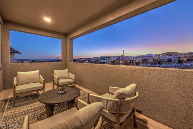 patio terrace at dusk with a balcony