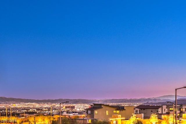 property's view of city with a mountain view