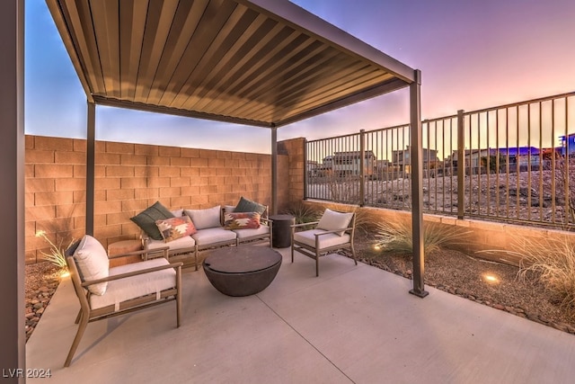 patio terrace at dusk with an outdoor hangout area