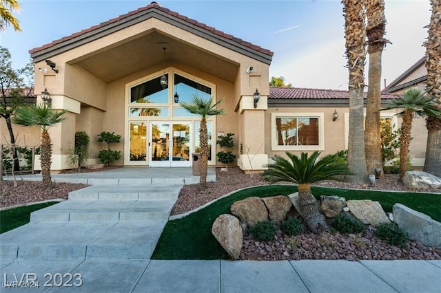 doorway to property featuring french doors