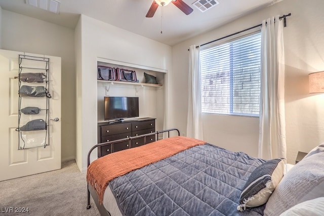 bedroom featuring carpet, a closet, and ceiling fan