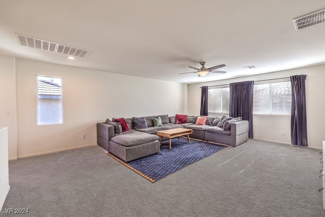 carpeted living room featuring ceiling fan