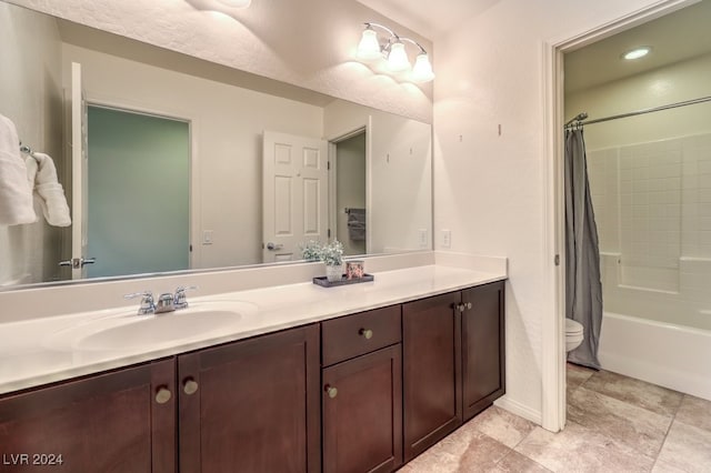 full bathroom with vanity, shower / bath combination with curtain, and toilet