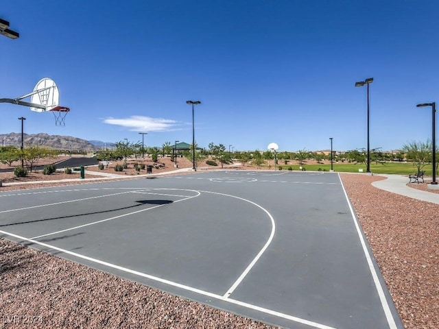 view of sport court with a mountain view