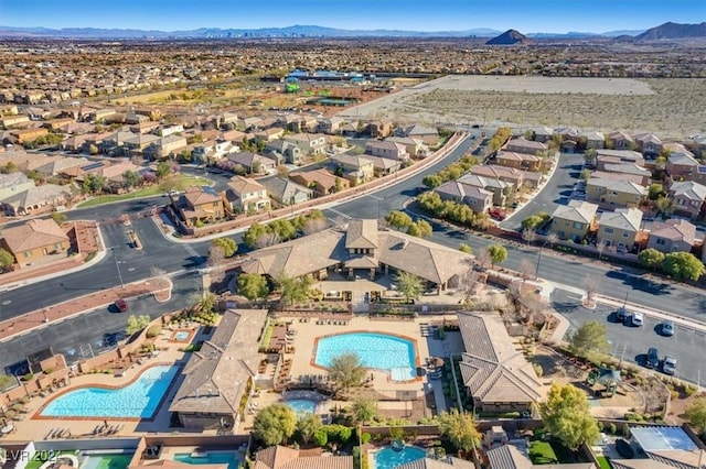 birds eye view of property featuring a mountain view