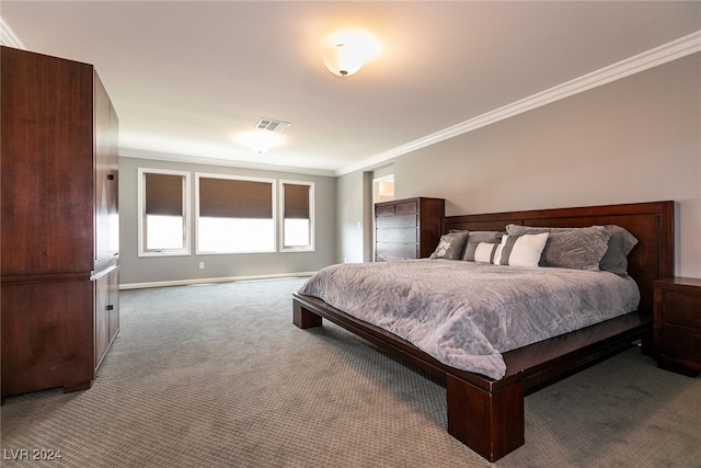 bedroom with carpet flooring and crown molding