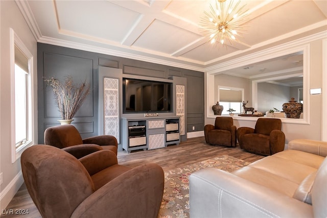 living room with a chandelier, wood-type flooring, coffered ceiling, and ornamental molding