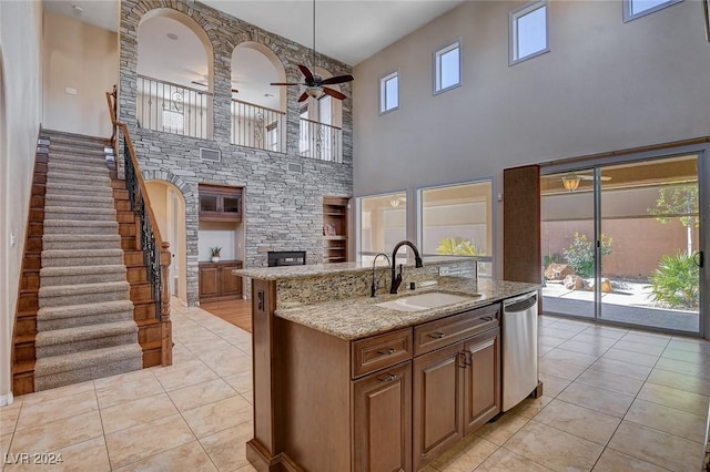 kitchen with dishwasher, a wealth of natural light, ceiling fan, and sink