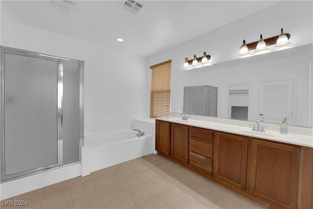 bathroom with vanity and independent shower and bath