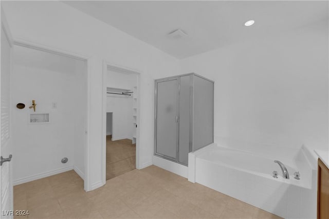 bathroom with separate shower and tub