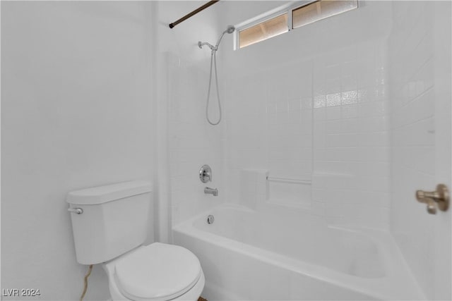 bathroom with shower / bath combination and toilet