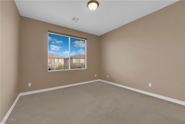 empty room featuring carpet flooring