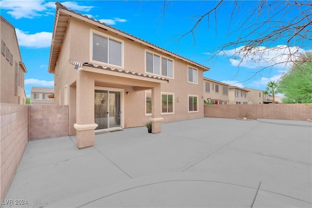 rear view of property with a patio