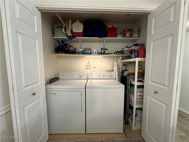 clothes washing area with washer and dryer