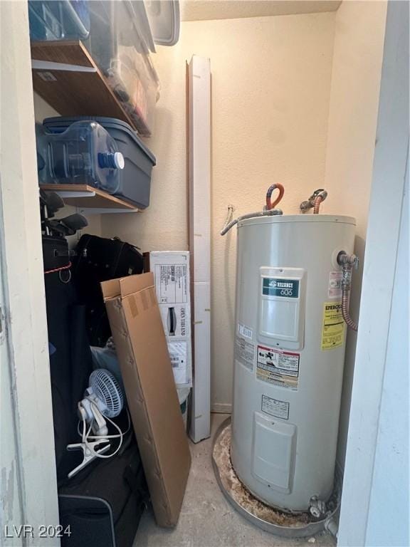 utility room with electric water heater