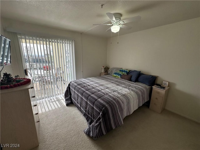 bedroom with access to outside, ceiling fan, light carpet, and a textured ceiling