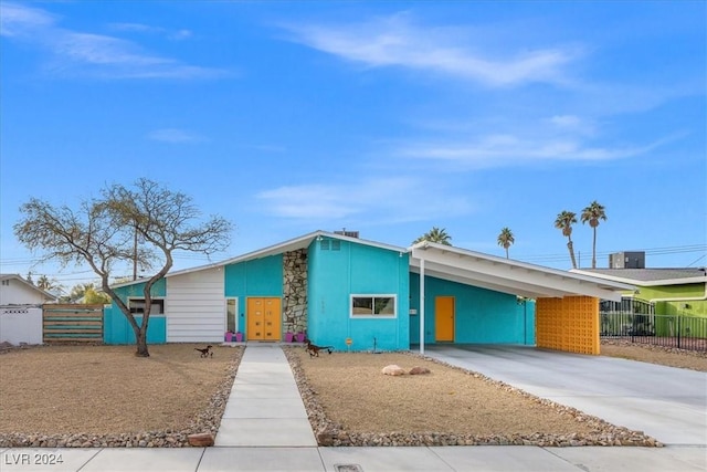 single story home featuring a carport