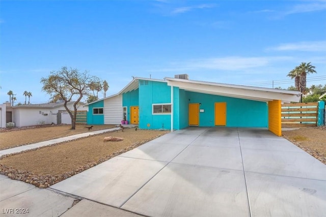 view of front of home with a carport