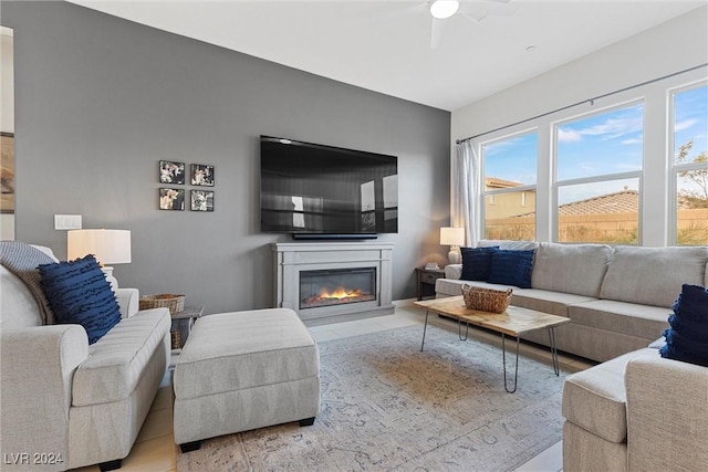 living room featuring ceiling fan and light tile patterned floors