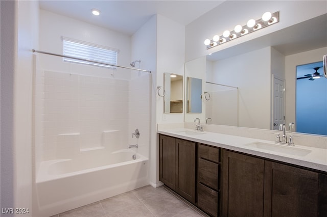 bathroom with bathing tub / shower combination, ceiling fan, tile patterned flooring, and vanity