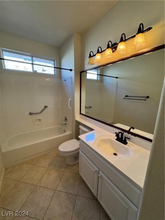 full bathroom featuring washtub / shower combination, vanity, toilet, and tile patterned flooring