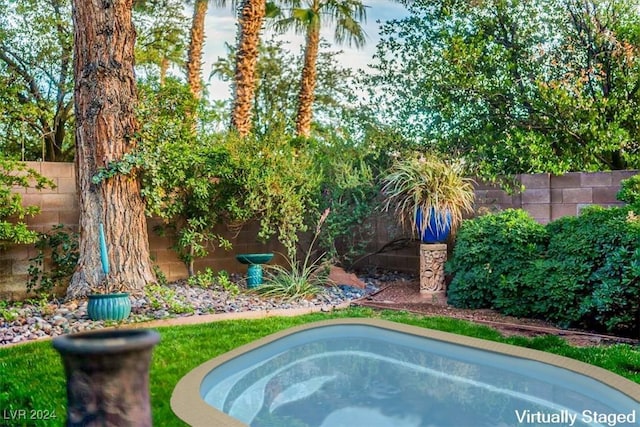 view of pool with a jacuzzi