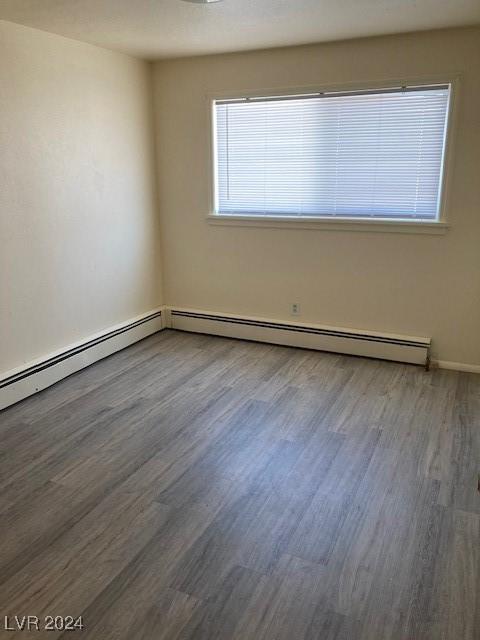 spare room featuring dark wood-type flooring