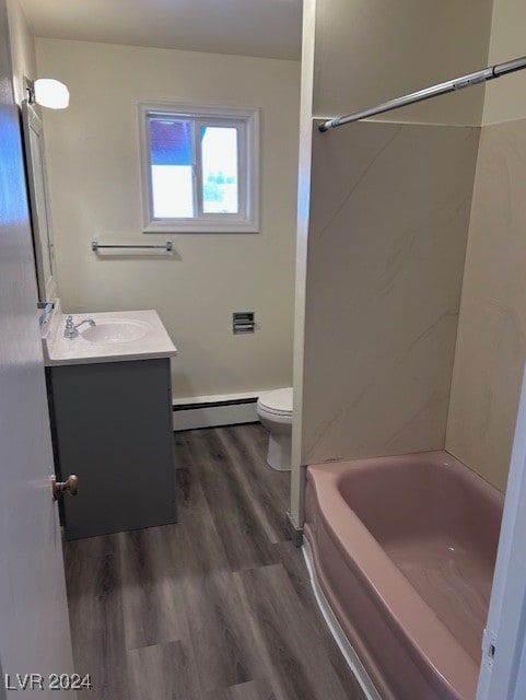 full bathroom featuring vanity, shower / washtub combination, baseboard heating, wood-type flooring, and toilet