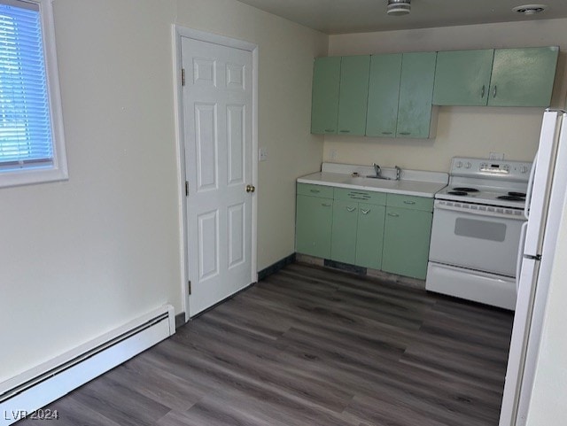 kitchen featuring white appliances, green cabinets, sink, baseboard heating, and dark hardwood / wood-style flooring