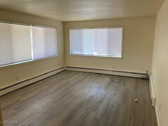 spare room featuring dark wood-type flooring