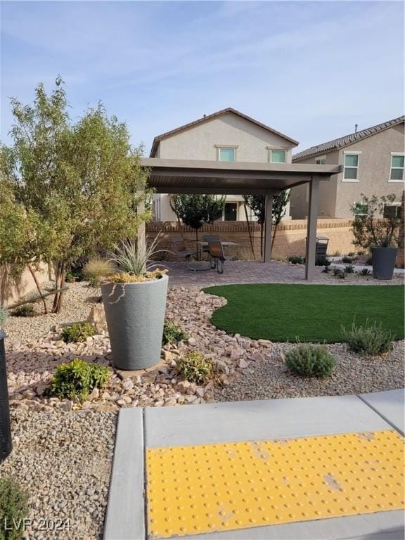 view of home's community featuring fence and a patio area