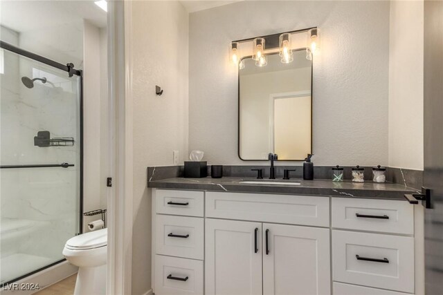 8705 Villa Ridge Dr, Las Vegas, NV 89134 - bathroom with vanity, a stall shower, and a baseboard heating unit