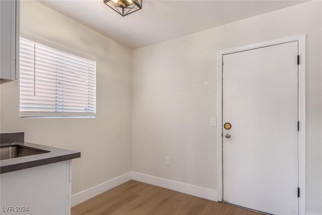 8705 Villa Ridge Dr, Las Vegas, NV 89134 - unfurnished dining area featuring light wood finished floors and baseboards