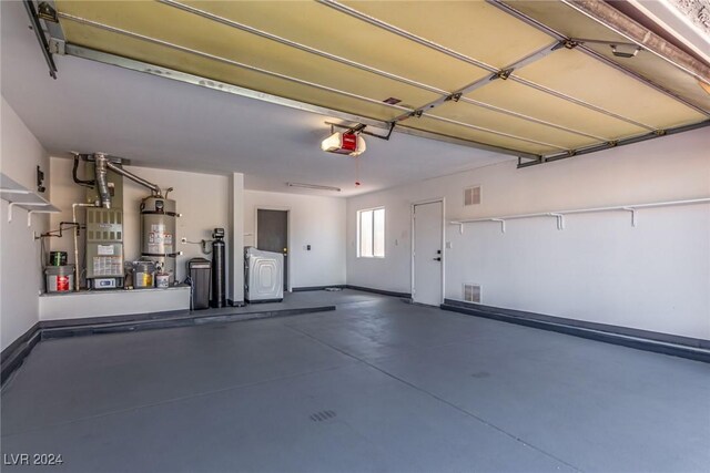 8705 Villa Ridge Dr, Las Vegas, NV 89134 - garage featuring a garage door opener, secured water heater, separate washer and dryer, and heating unit