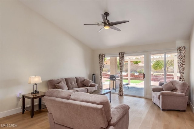 living room featuring light hardwood / wood-style floors, ceiling fan, and lofted ceiling