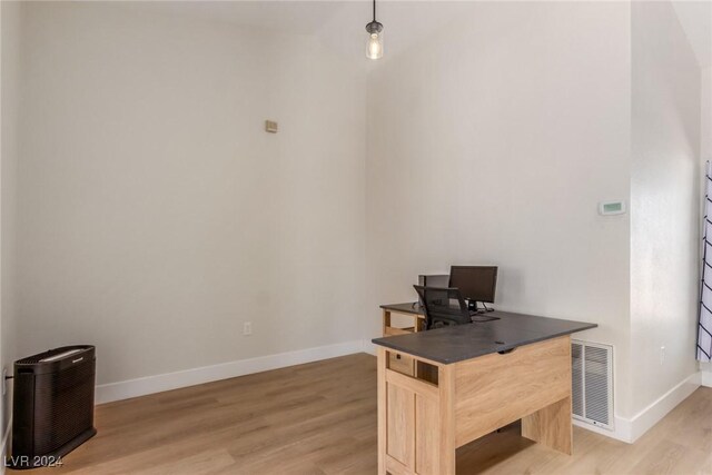 8705 Villa Ridge Dr, Las Vegas, NV 89134 - home office featuring light wood finished floors and vaulted ceiling