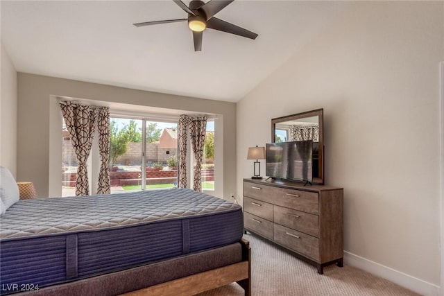 carpeted bedroom featuring ceiling fan and vaulted ceiling