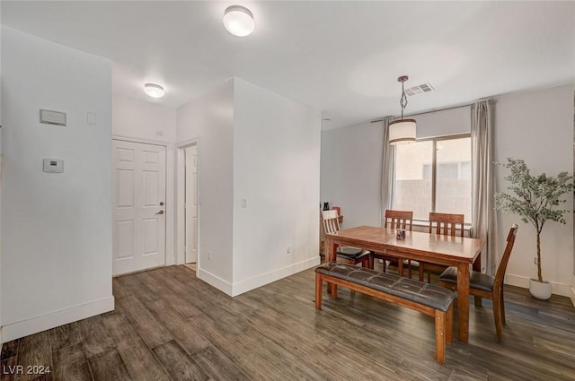 dining room with dark wood-type flooring