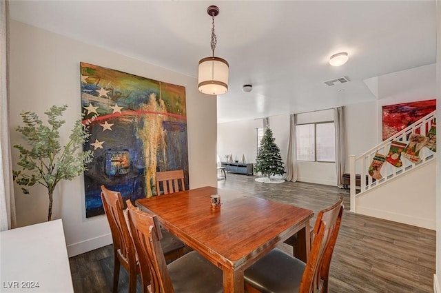 dining space featuring dark hardwood / wood-style floors